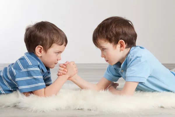 Arm wrestling and two brothers, — Stock Photo, Image