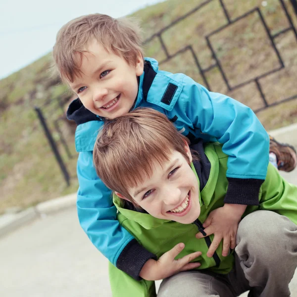 Two brothers laugh, outdoor — Stock Photo, Image