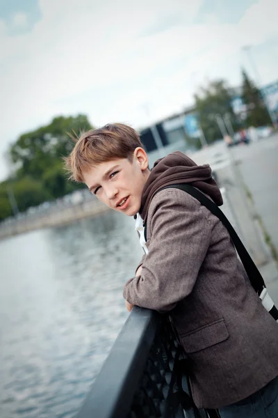 Portrait of teenager on background of river — Stock Photo, Image