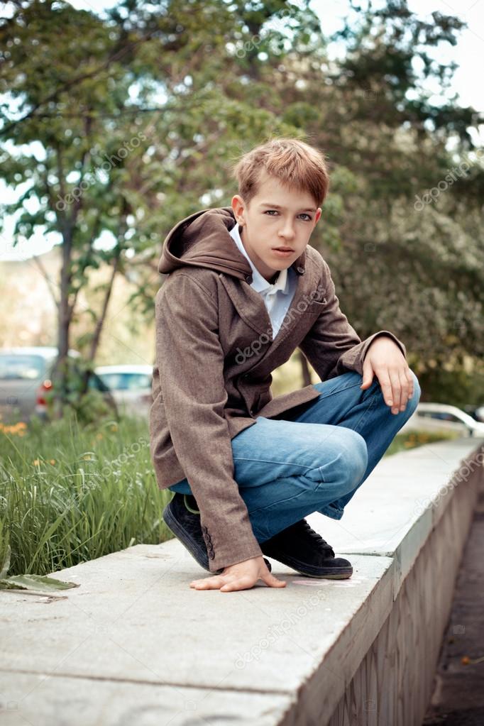 Portrait of teenager on background of city.