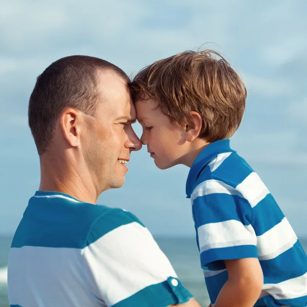 Father and sons walking on beach — Stock Photo, Image