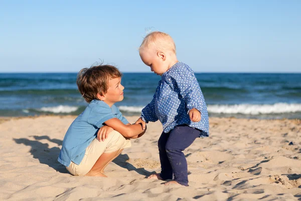 Brother and sister on walk near sea — Stock Image Brother and sister on walk near sea Stock Picture