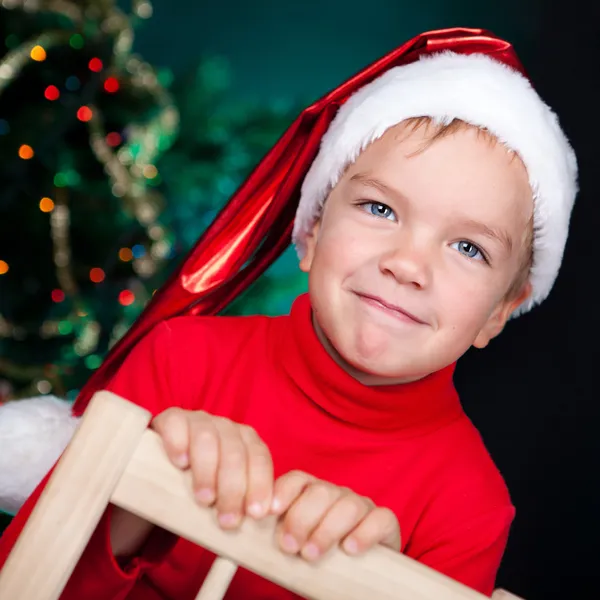 Happy small boy in santa hat Royalty Free Stock Photos