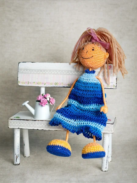 Knitted doll in blue dress — Stock Photo, Image