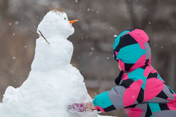 Girl Hugs Snowman Winter Walk Outdoor — Stock Photo, Image