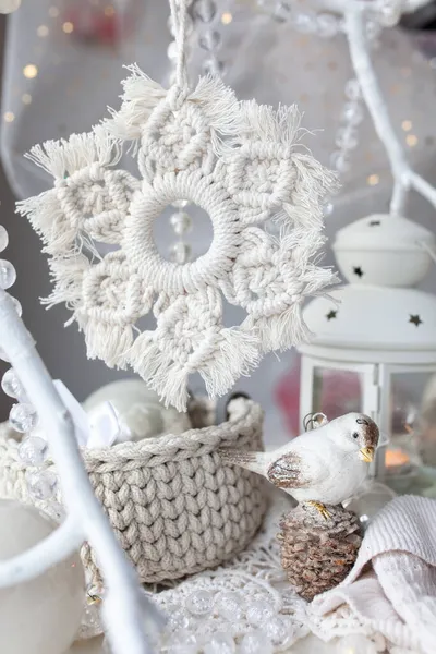 Beautiful New Year\'s decor using macrame technique. Handmade, Macrame cord snowflake hanging on a white branch