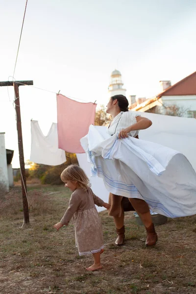 Beautiful Woman Long Hair Hangs White Sheets Air Lighthouse Street — Stock Photo, Image