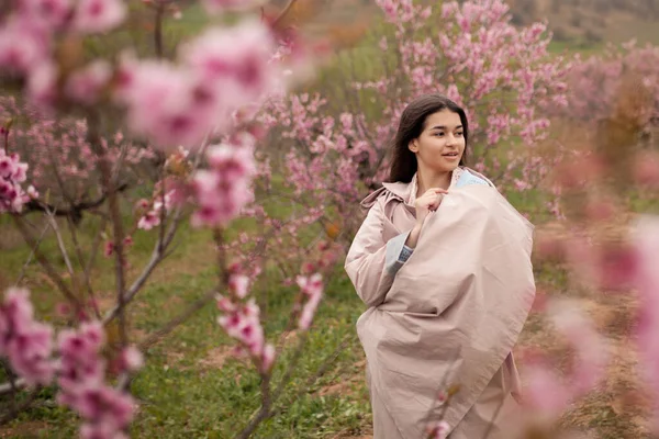 Beautiful Girl Spring Peach Garden Teenager Dressed Raincoat Jeans — Stock Photo, Image