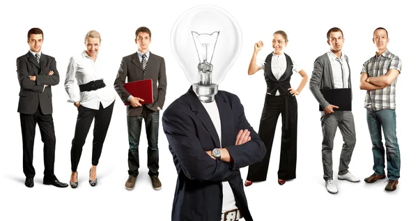 Equipe de negócios com cabeça de lâmpada — Fotografia de Stock