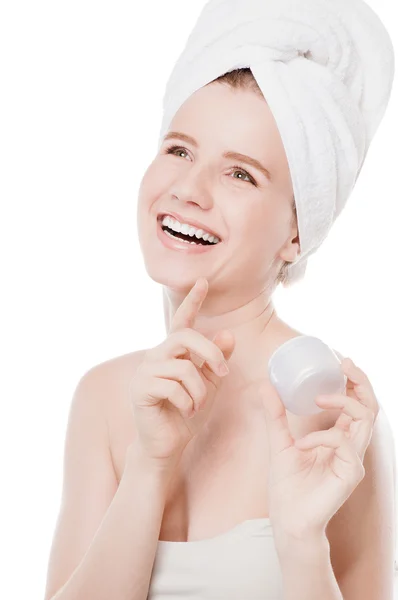 Woman applying moisturizer cream on face — Stock Photo, Image