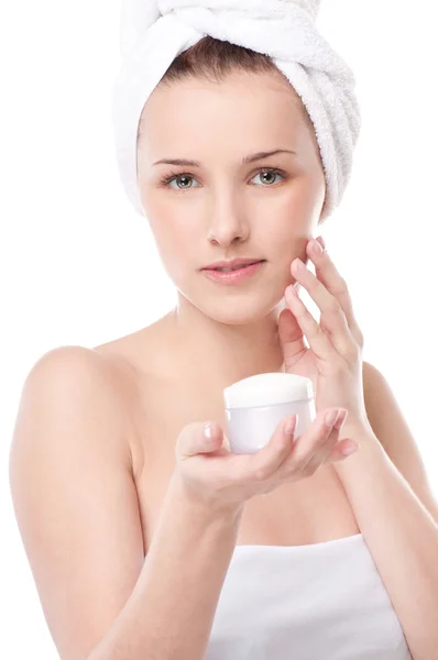 Woman applying moisturizer cream on face — Stock Photo, Image