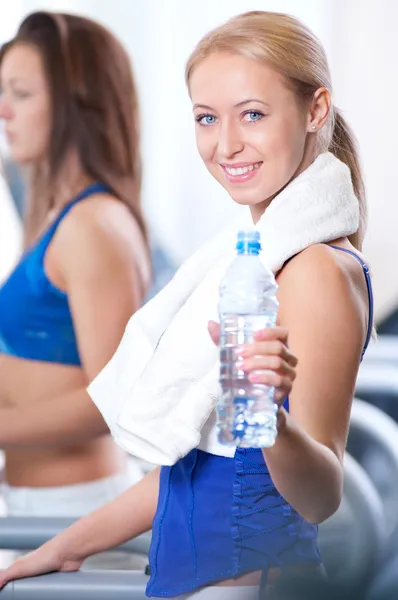 Women drinking water after sports — Stock Photo, Image