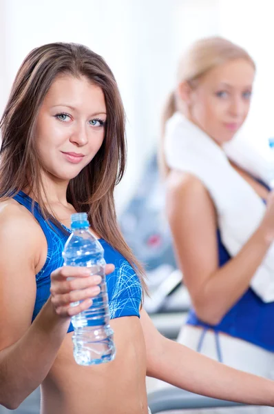 Women drinking water after sports — Stock Photo, Image