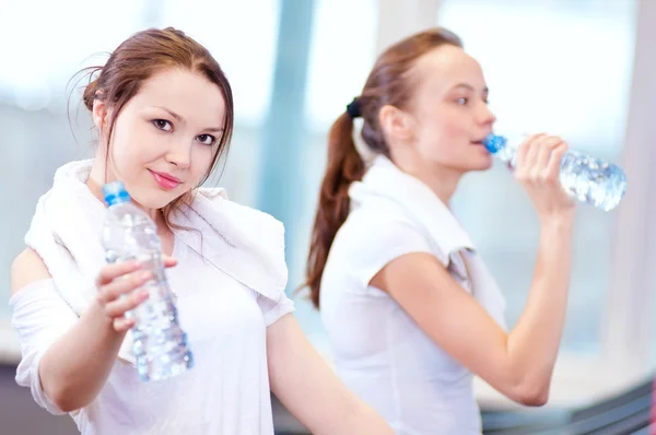 Women drinking water after sports — Stock Photo, Image