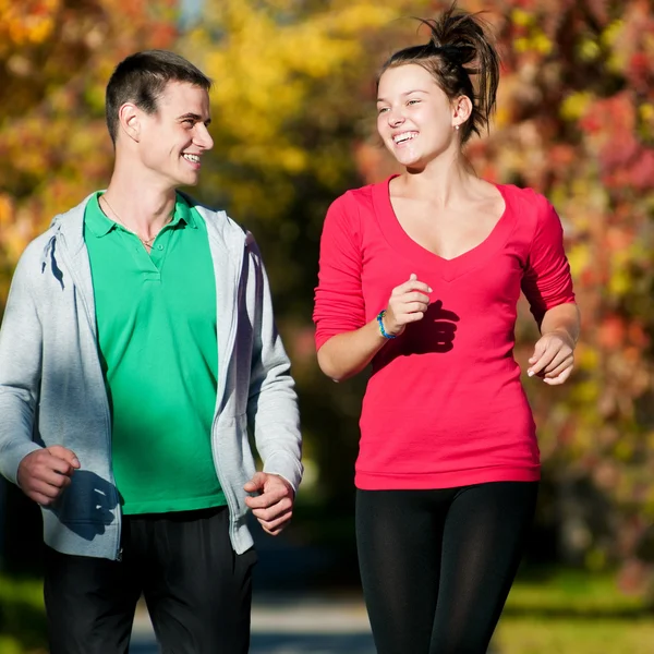 Young man and woman jogiing Stock Photo