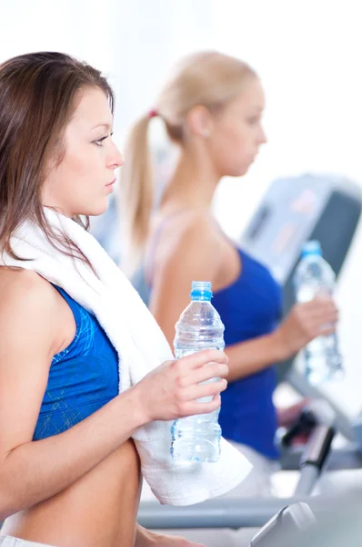 Women drinking water after sports — Stock Photo, Image