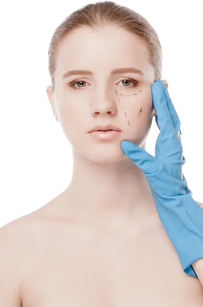 Beautician draw correction lines on woman face — Stock Photo, Image