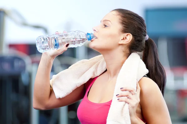 Man and woman drinking water after sports Stock Photo