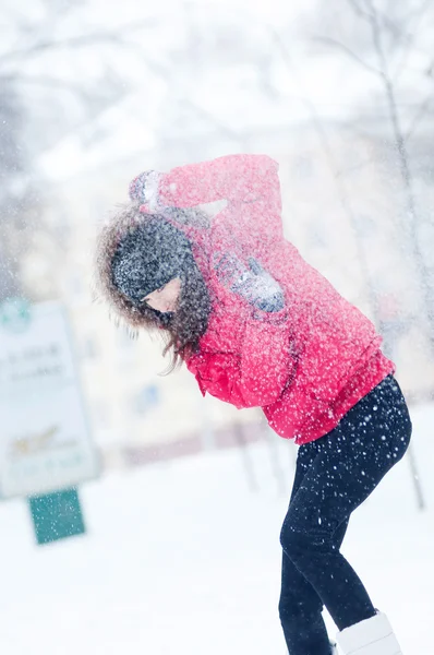 Happy young woman plays with a snow — Stock Photo, Image