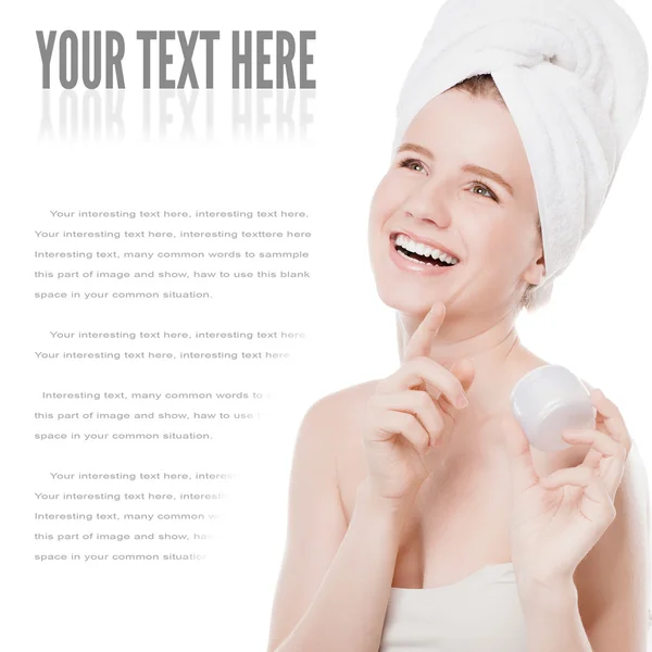 Woman applying moisturizer cream on face — Stock Photo, Image