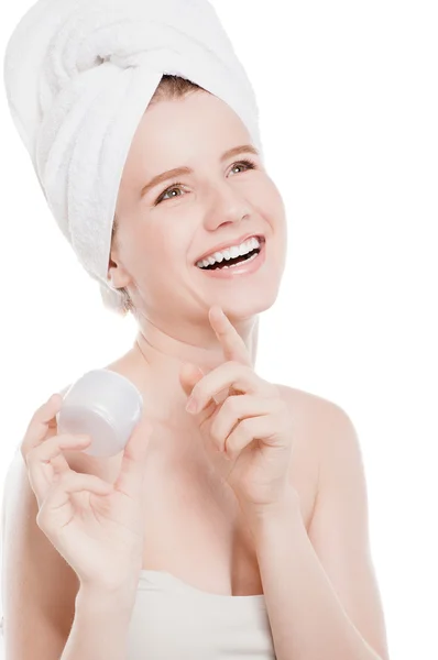 Woman applying moisturizer cream on face — Stock Photo, Image