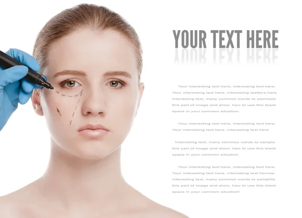 Beautician draw correction lines on woman face — Stock Photo, Image