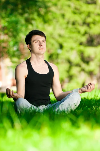 A young man doing yoga exercise