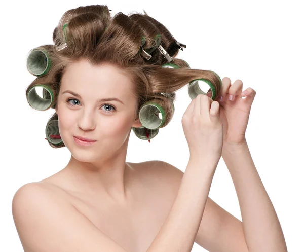 Woman curling her hair with roller — Stock Photo, Image