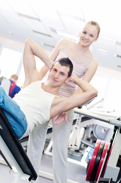 Gym man and woman doing exercise Stock Photo