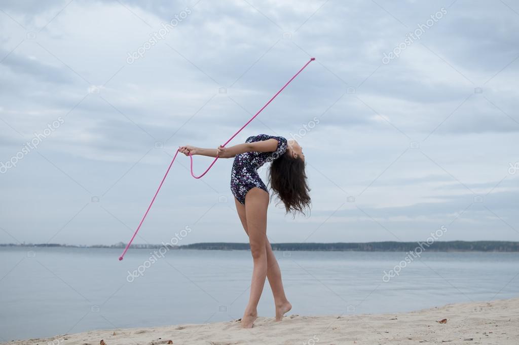 Young gymnast girl dance with skipping rope — Stock Photo © markin