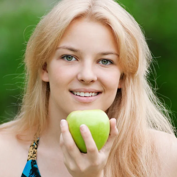 Beautiful woman with green apple — Stock Photo, Image