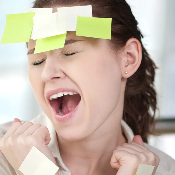 Mujer de negocios con pegatinas —  Fotos de Stock