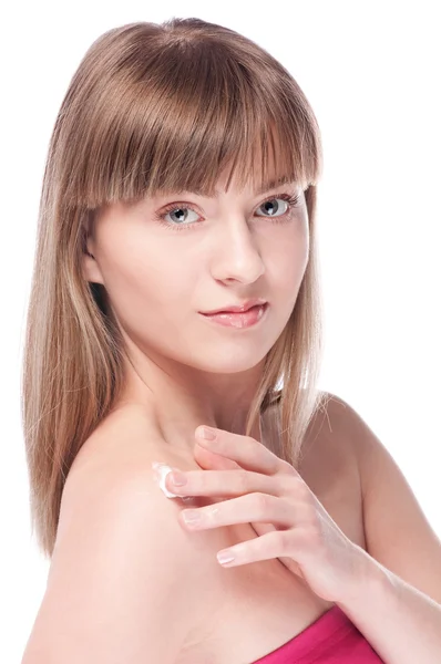 Woman applying moisturizer cream on face — Stock Photo, Image