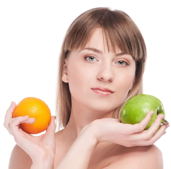 Young woman with green apple and orange — Stock Photo, Image