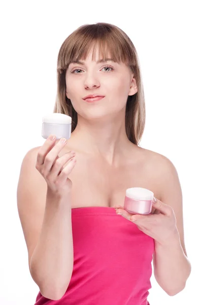 La mujer ofrece crema hidratante en blanco Fotos de stock