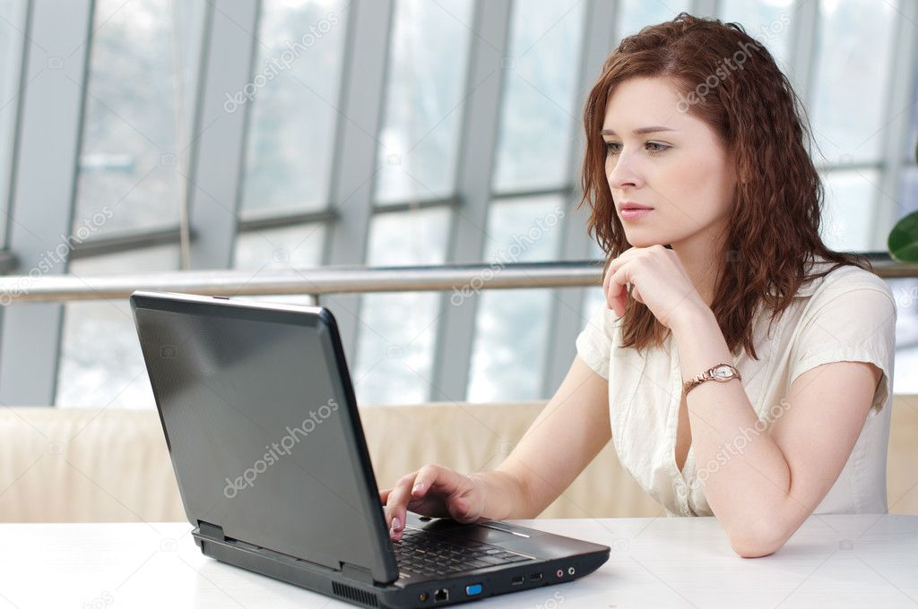 Young business woman with laptop