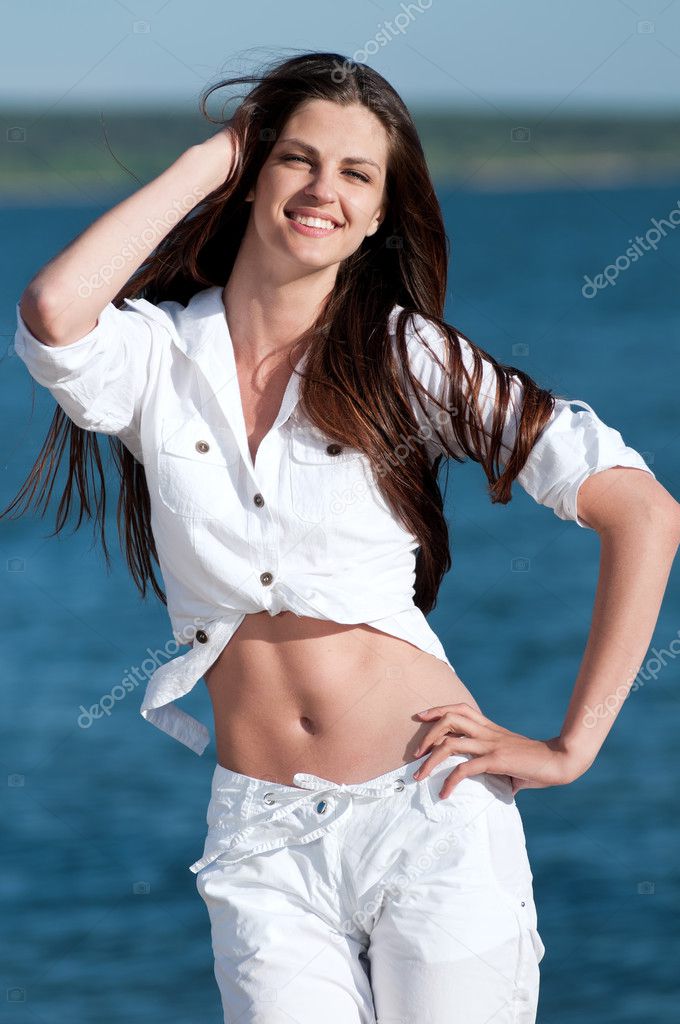 Sexy woman posing on the beach