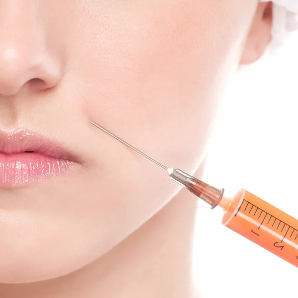 Injection cosmétique de botox dans le visage Images De Stock Libres De Droits