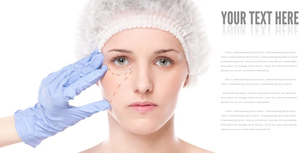Beautician draw correction lines on woman face Stock Photo