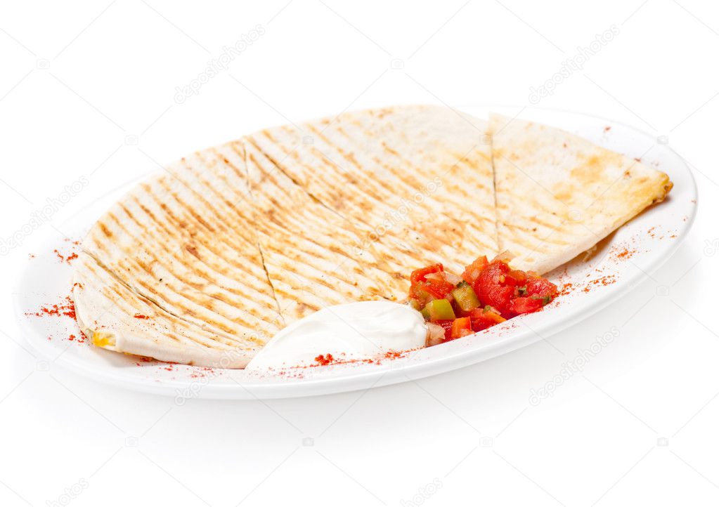 Breakfast Quesadilla with Sour Cream and vegetables on plate. Isolated on white