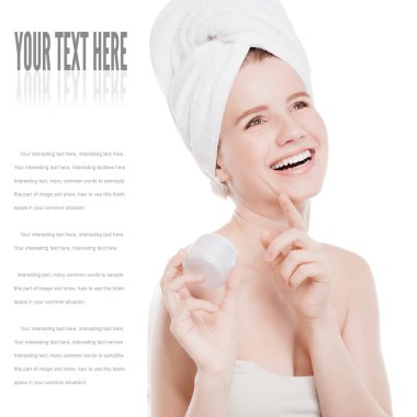Woman applying moisturizer cream on face clipart