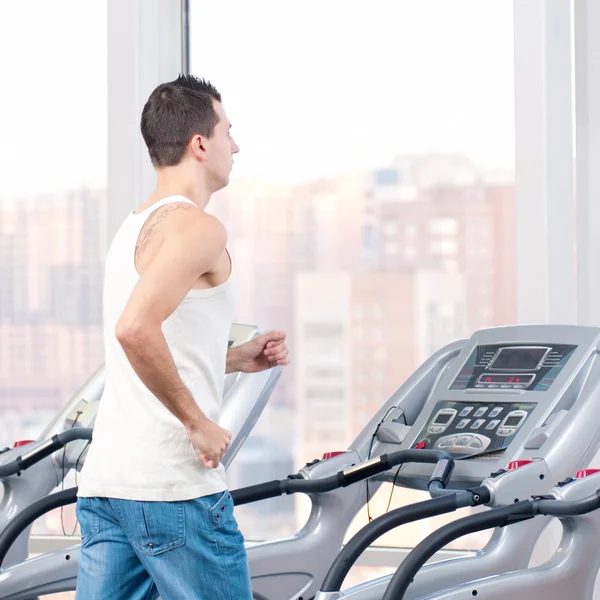 Man at the gym exercising. Run. — Stock Photo, Image