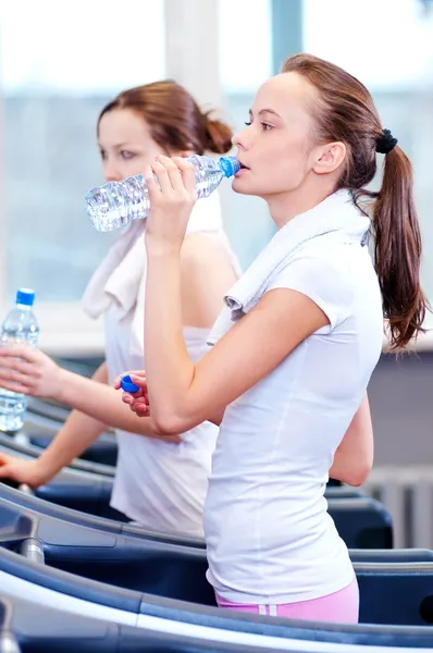 Women drinking water after sports — Stock Photo, Image