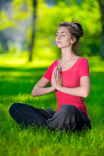 Young woman doing yoga exercises — Stock Photo, Image