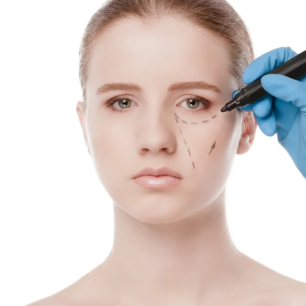 Beautician draw correction lines on woman face — Stock Photo, Image