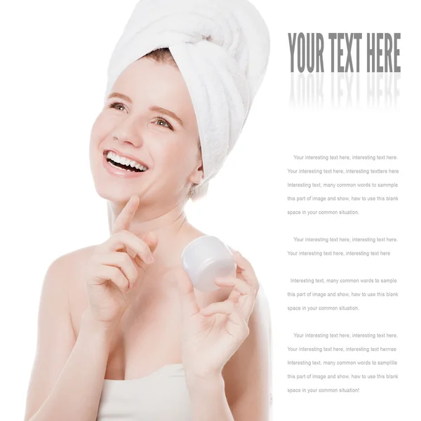 Woman applying moisturizer cream on face — Stock Photo, Image