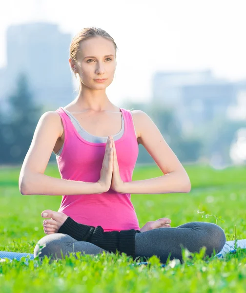 Woman doing stretching fitness exercise Yoga. lotus — Stock Photo, Image