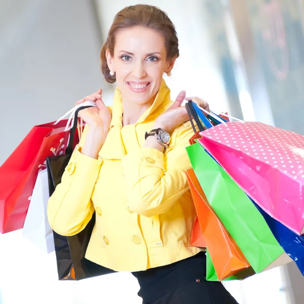 Shopping woman with color bags — Stock Photo, Image