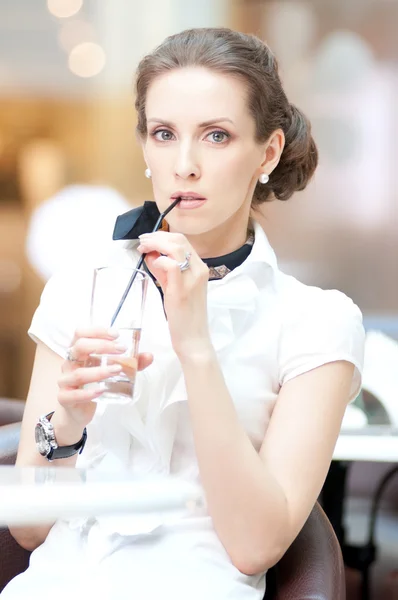 Portrait of thirsty business woman drinking water at office Stock Image