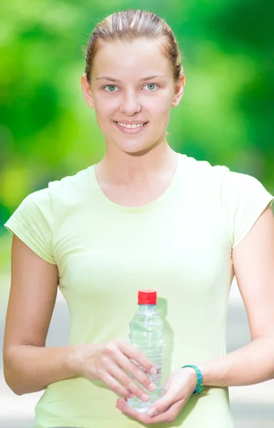 Woman drinking mineral water — Stock Photo, Image